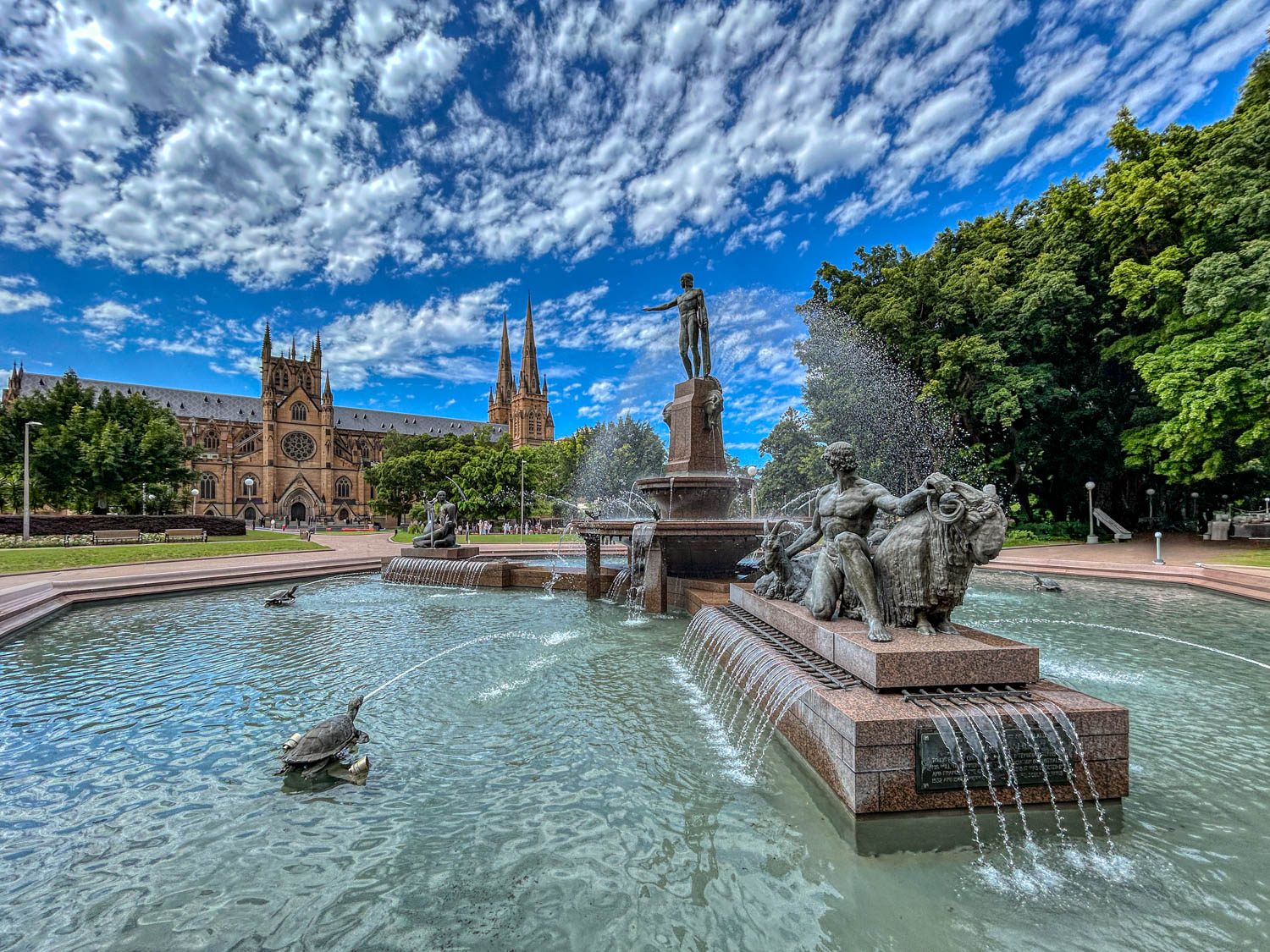 Art deco fountain in Hyde Park, with Saint Mary's Cathedral in the background