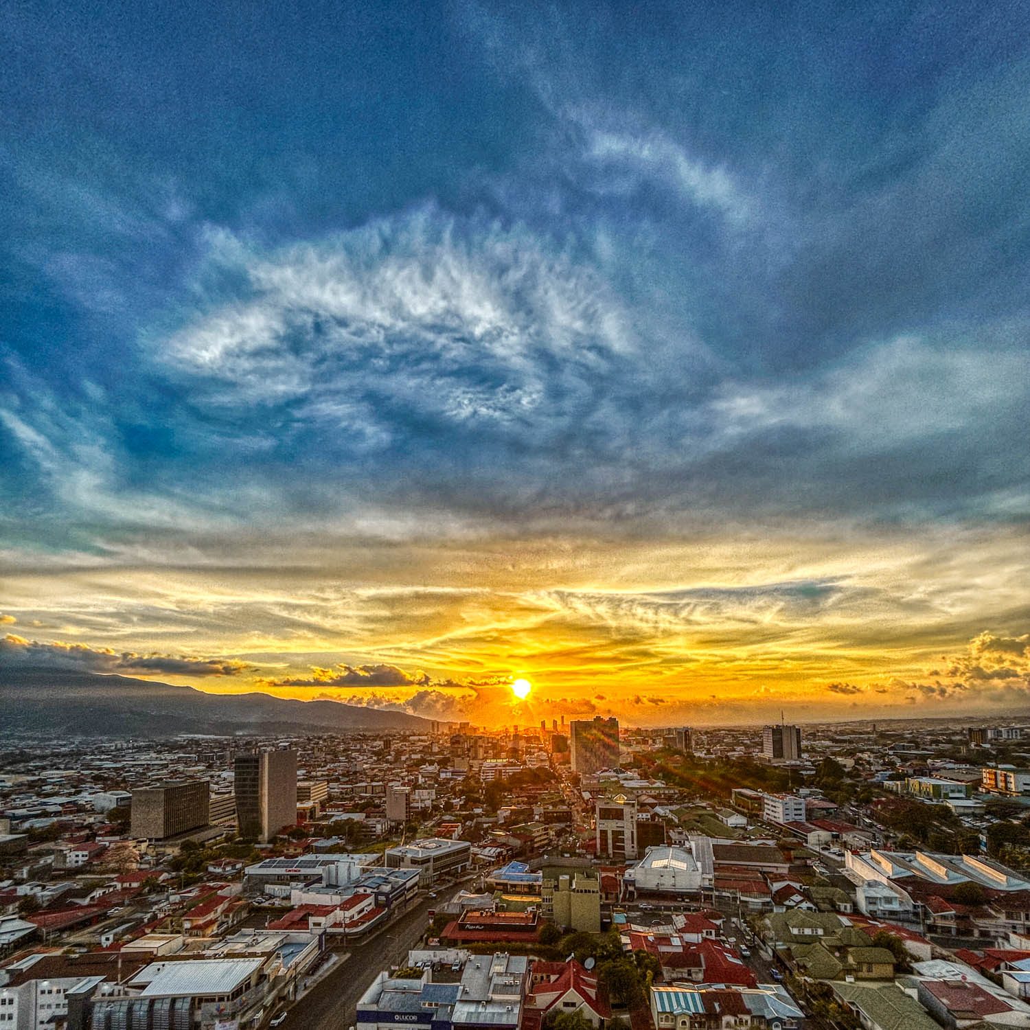 Sunset from my window in San José.
